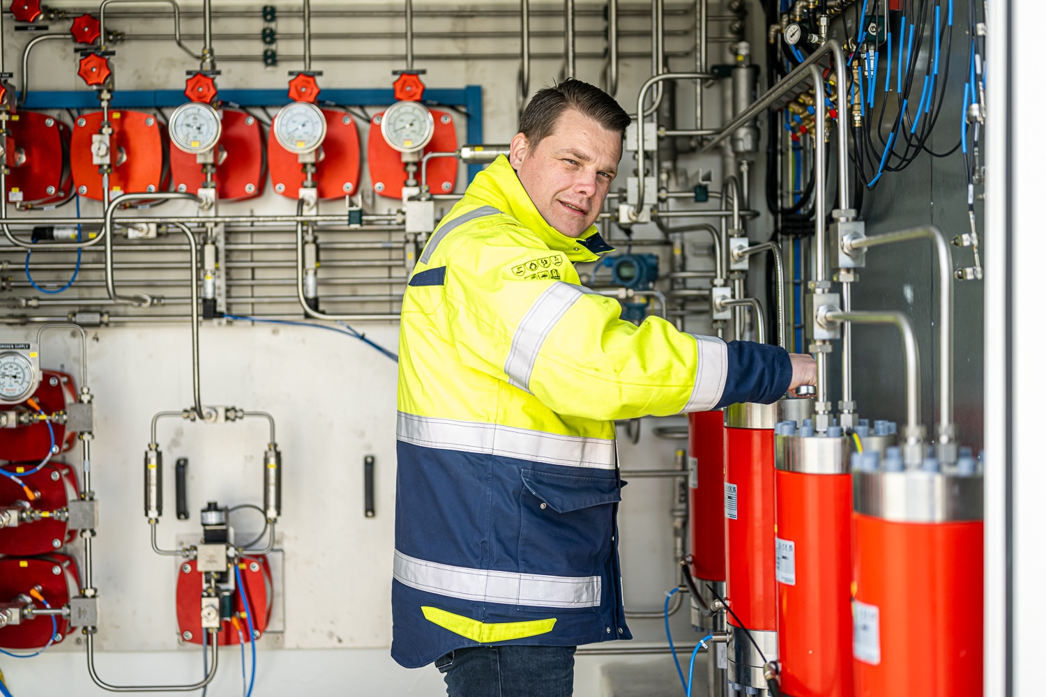 Photo: engineer working on a Resato hydrogen refueling system